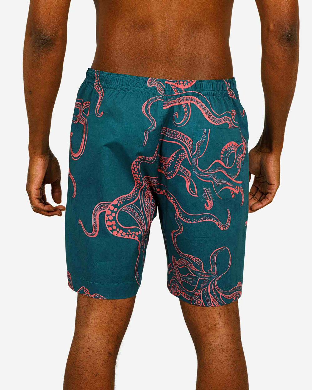 Mens lounge shorts with pink octopuses on a turquoise background