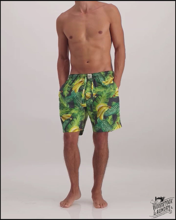 Mens lounge shorts with a palm tree pattern on a creme background
