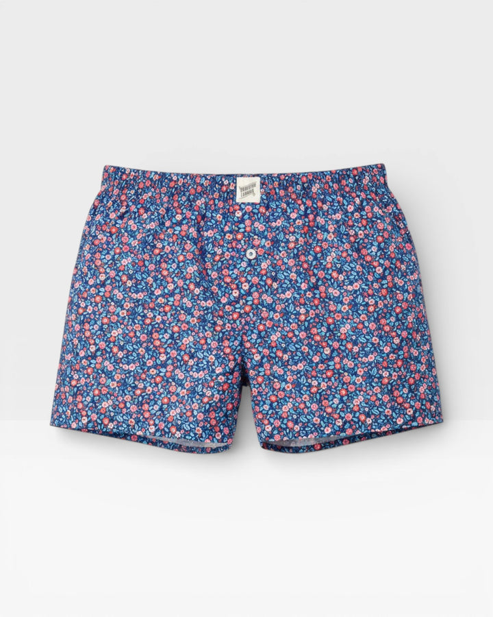 Mens blue cotton boxer shorts featuring a pink and orange Dipsy floral print.