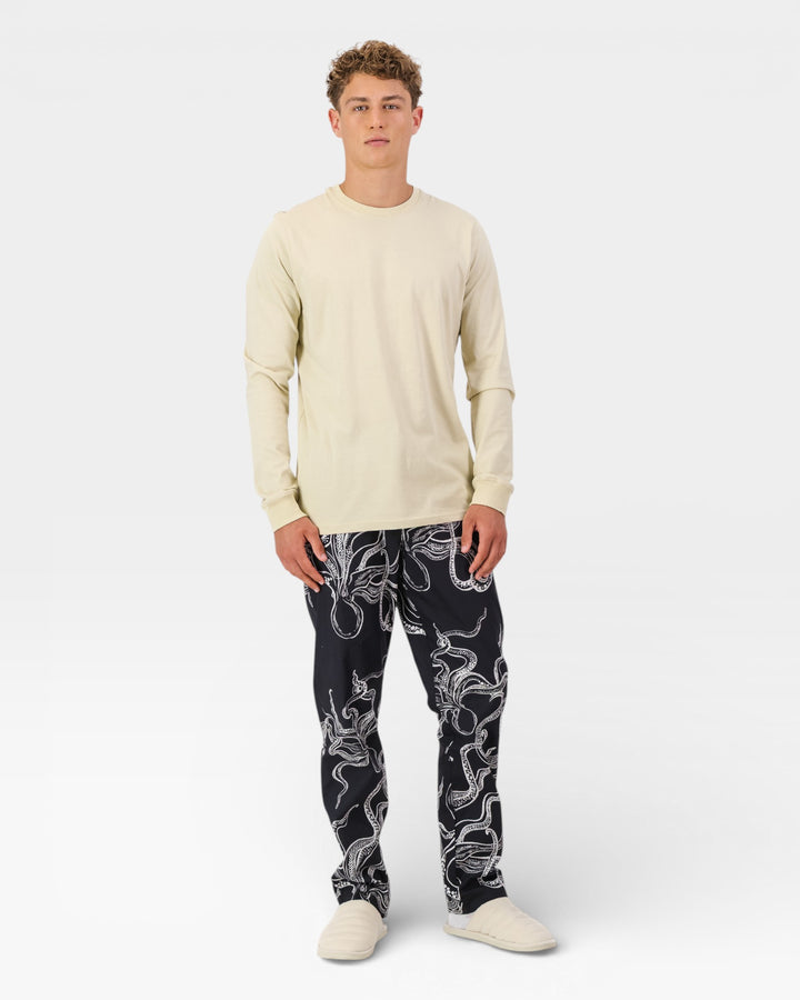 Mens black lounge pants with white octopuses and a stone colored ls t-shirt.