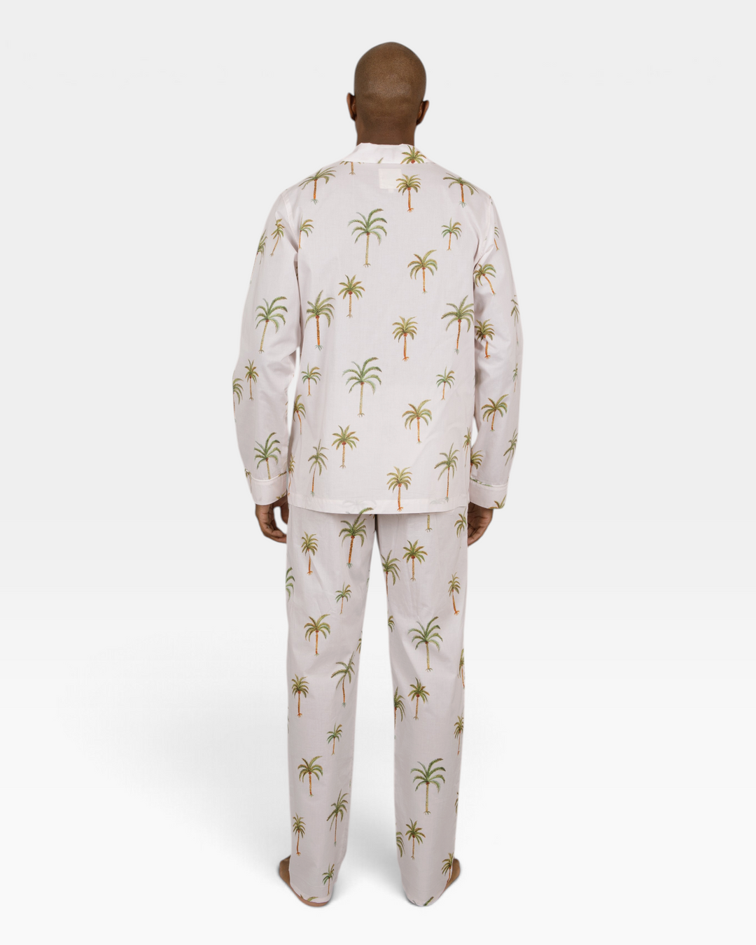 Mens beige two piece pyjamas set with palm trees.