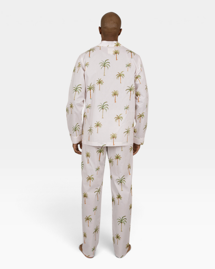 Mens beige two piece pyjamas set with palm trees.