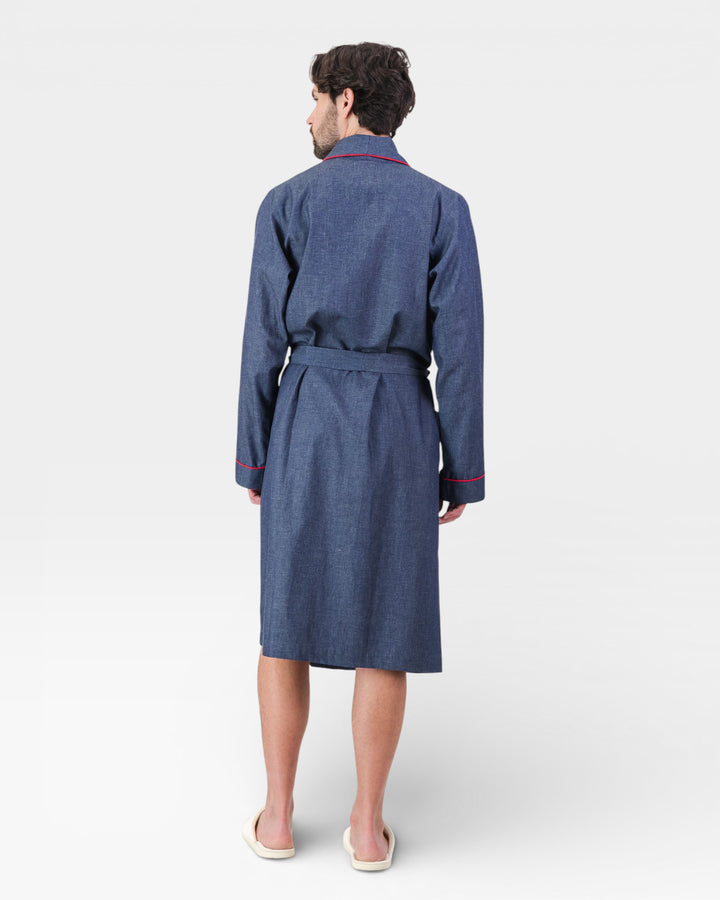 Mens blue dressing gown with red piping on a white background