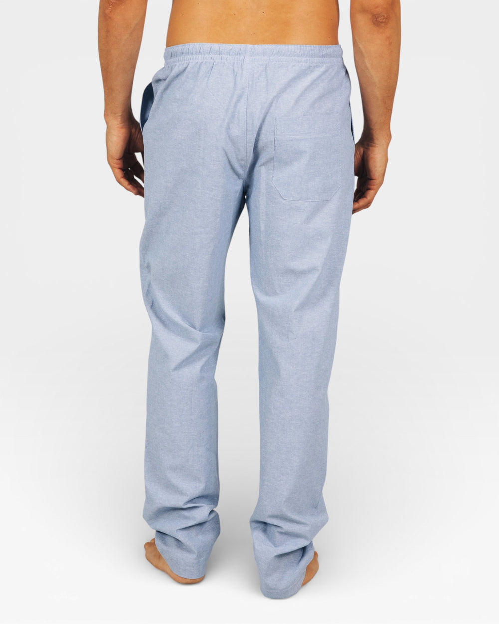 Mens Light blue lounge pants worn by a man on a white background