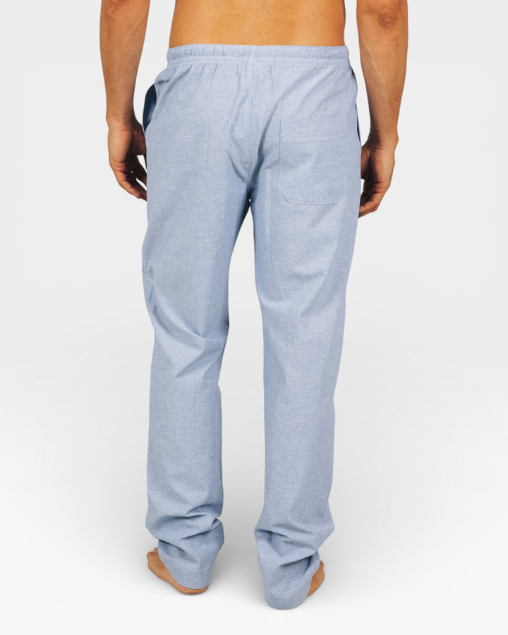 Mens Light blue lounge pants worn by a man on a white background