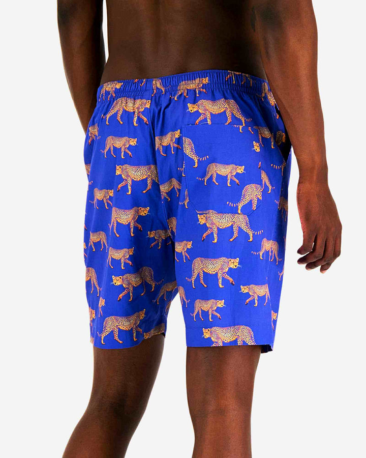 Mens lounge shorts with cheetahs on an electric blue background