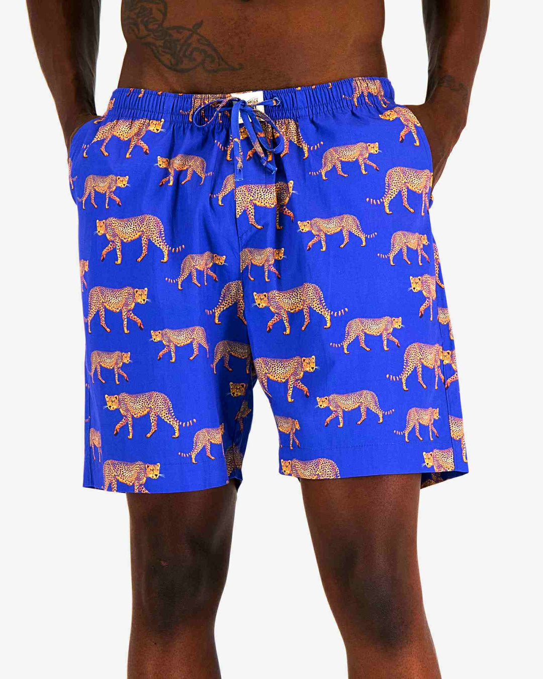 Mens lounge shorts with cheetahs on an electric blue background