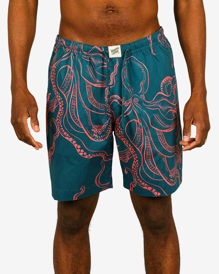 Mens lounge shorts with pink octopuses on a turquoise background