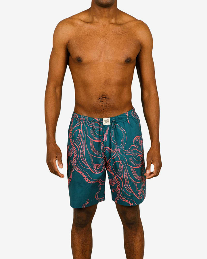 Mens lounge shorts with pink octopuses on a turquoise background