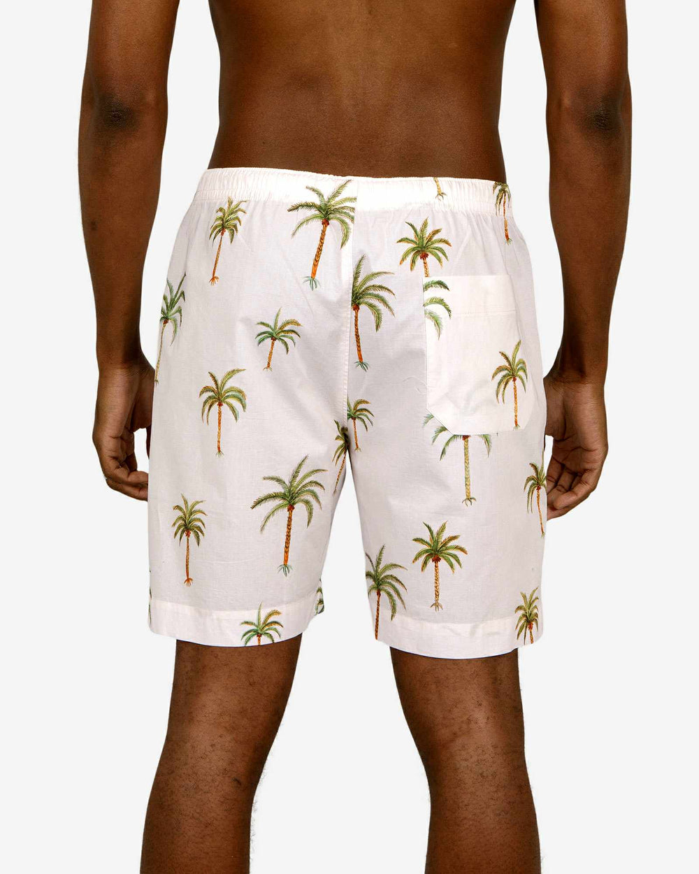 Mens lounge shorts with a palm tree pattern on a creme background