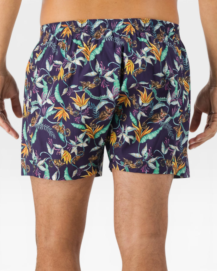 Back view of mens boxer shorts with bush babies, tropical foliage and vibrant blooms