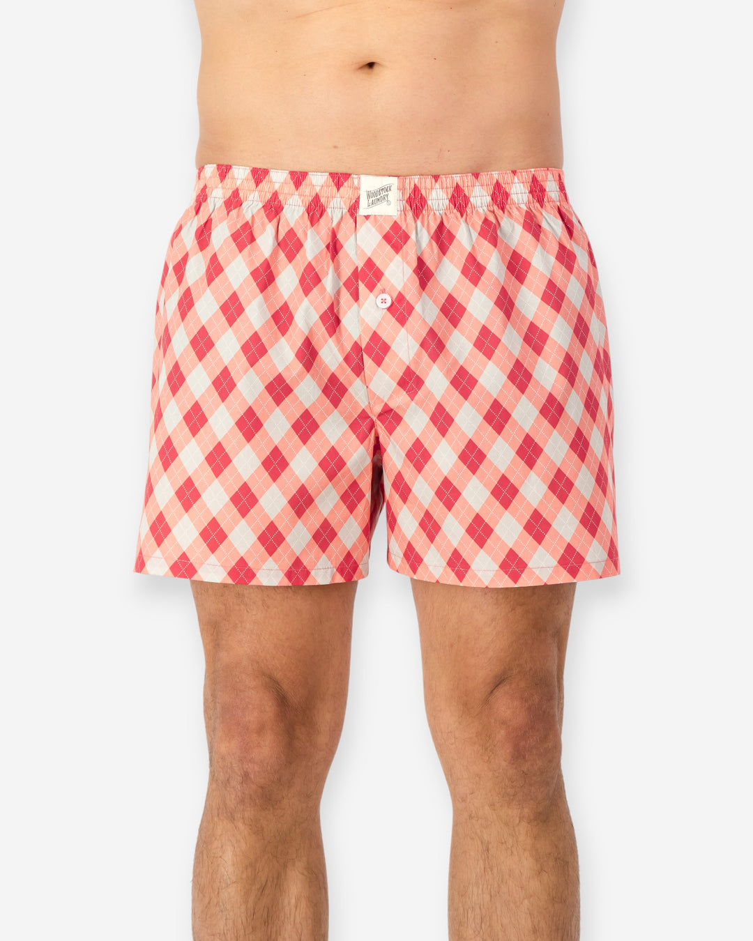 Red and white checkered boxer shorts on a white background