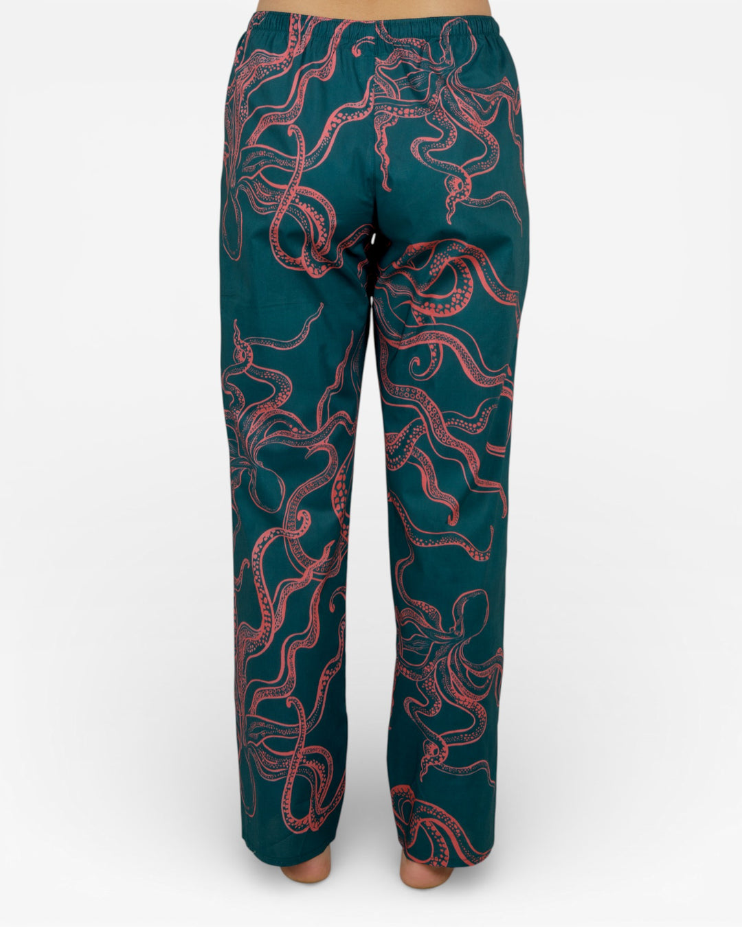 Close-up of pink octopus print on green cotton base