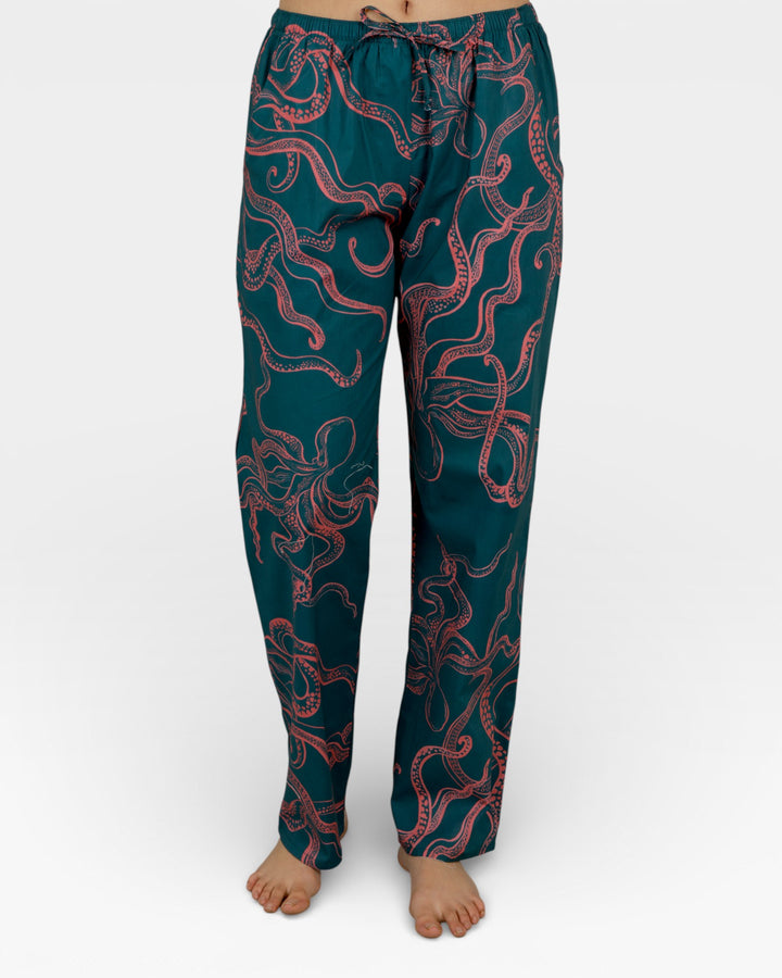 Pocket/Cuff.	Green pyjama bottoms with pockets and pink octopus motif