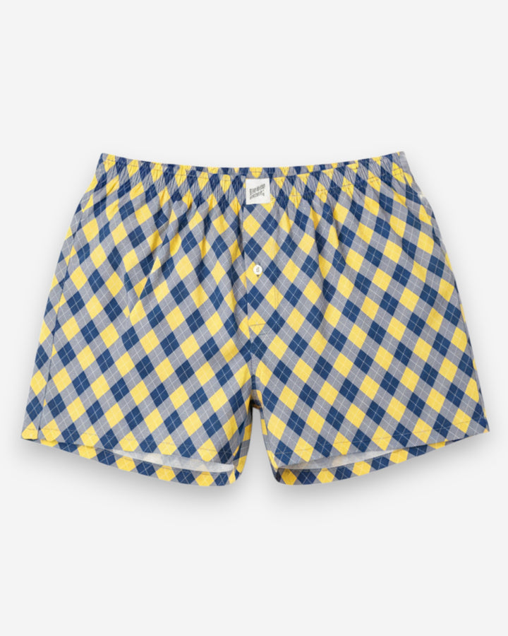 Blue and yellow checkered boxer shorts on a white background